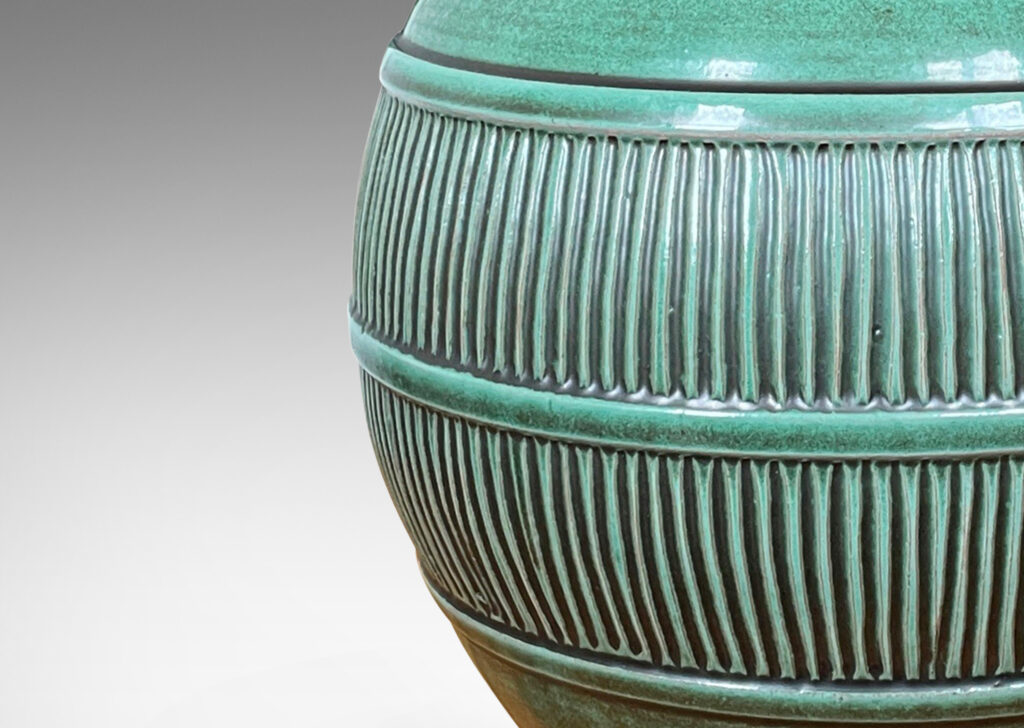 Gallery BAC tapered globe form with wide reeded relief band, earthenware with a tonal green glaze