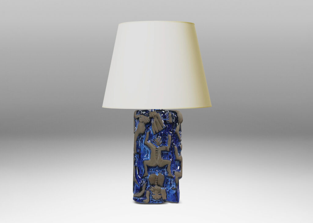 Gallery BAC rounded square pedestal forms with charming reliefs depicting climbing figures in matte brown against a shiny blue glazed field