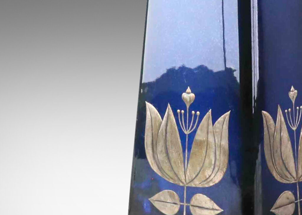 Gallery BAC tall angled pedestal forms with lustrous blue glazing and inlaid silver floral motifs