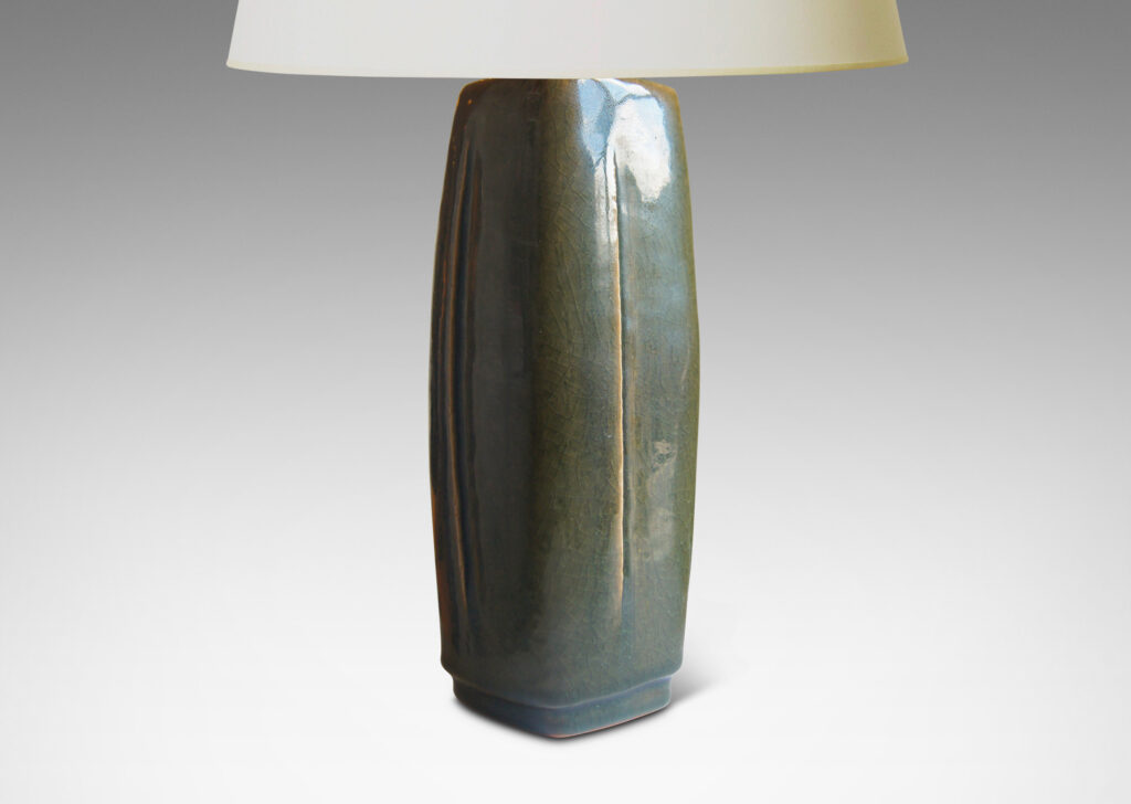 Gallery BAC tall squared form with four swelling sides with carved vertical lines; stoneware with a dark green glaze