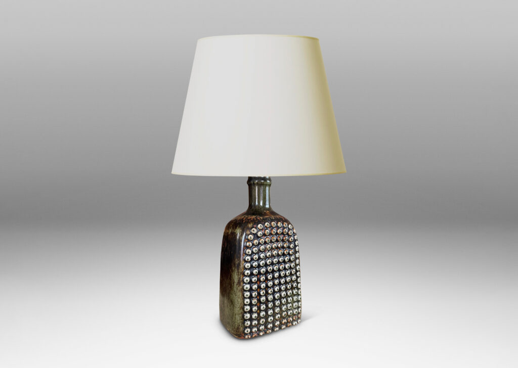 Gallery BAC squared bottle-like form with a grid of cleats on two sides in a dark brown glaze with hints of rust