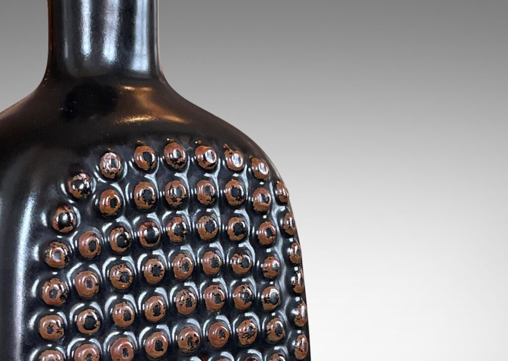 Gallery BAC squared bottle-like form with a grid of cleats on two sides in a chocolate brown glaze