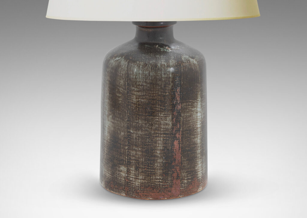 Gallery BAC cylindrical bell form in stoneware with a dry brushed black over green-tinted gray with touches of red luster