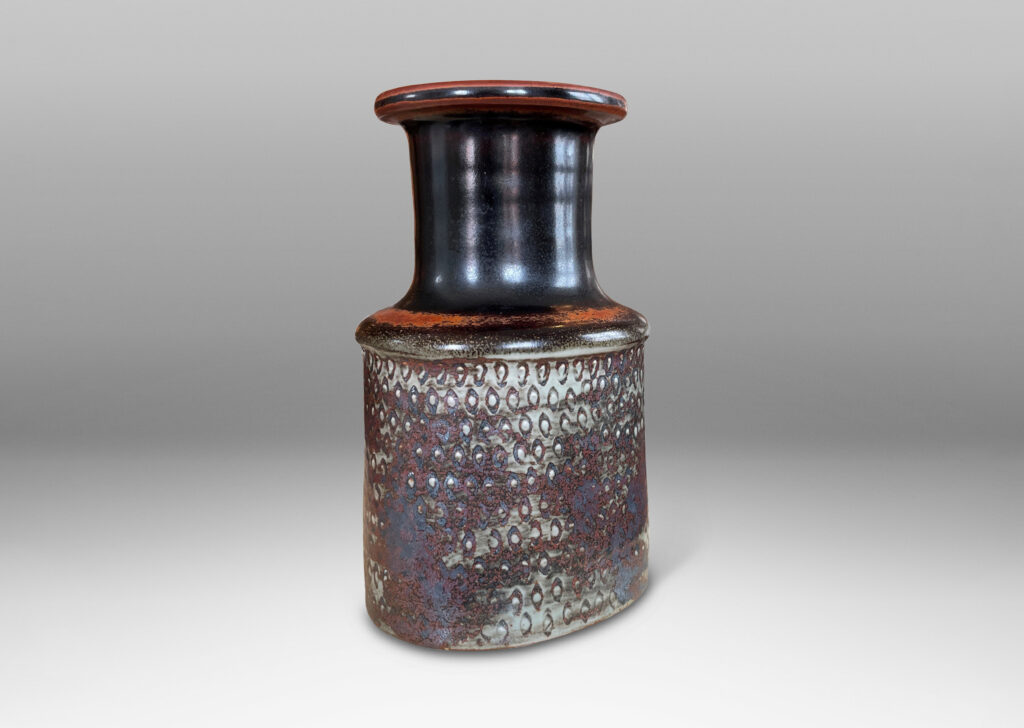 Gallery BAC bottle-like form with wide neck and textured body in gray, black and rust toned glazes