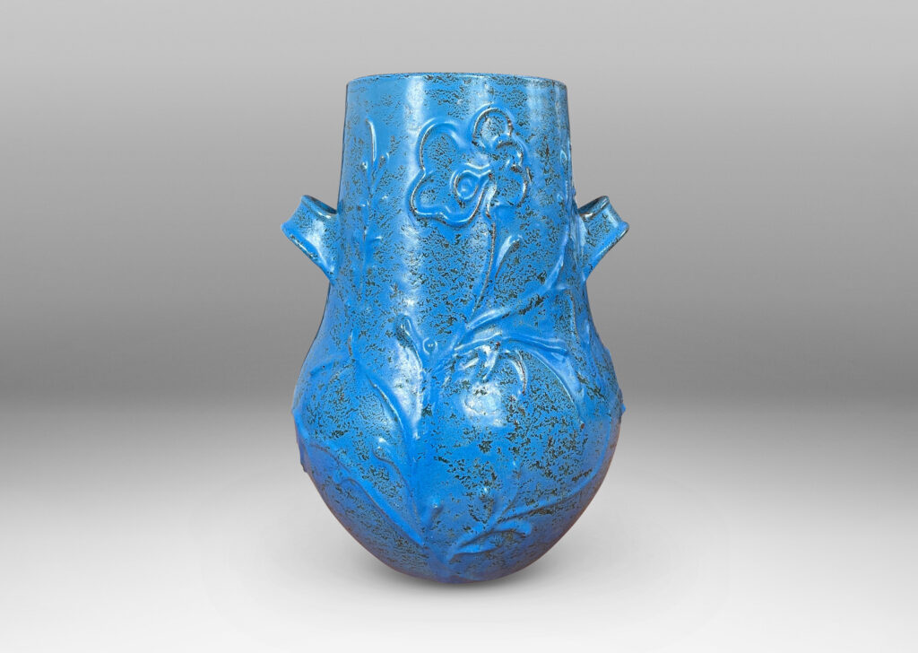 Gallery BAC gourd form with wide mouth, handles, and stylized floral reliefs, glazed in a cerulean blue