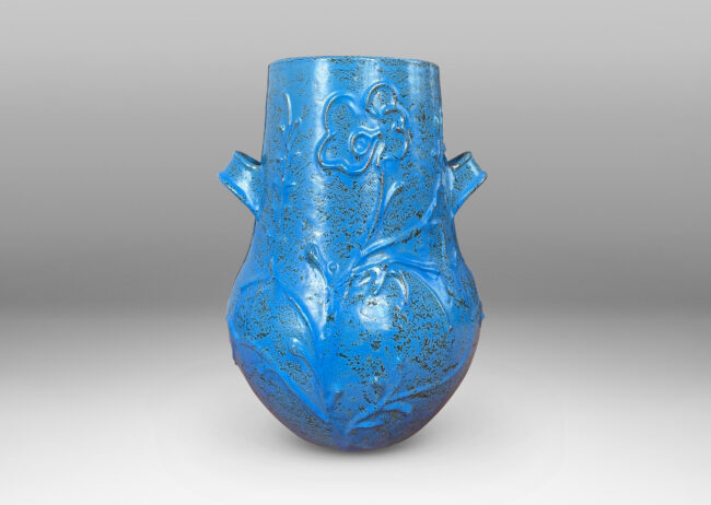 Gallery BAC gourd form with wide mouth, handles, and stylized floral reliefs, glazed in a cerulean blue