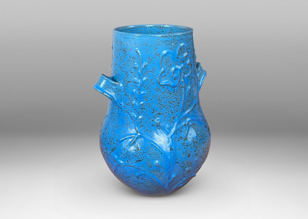 Gallery BAC gourd form with wide mouth, handles, and stylized floral reliefs, glazed in a cerulean blue