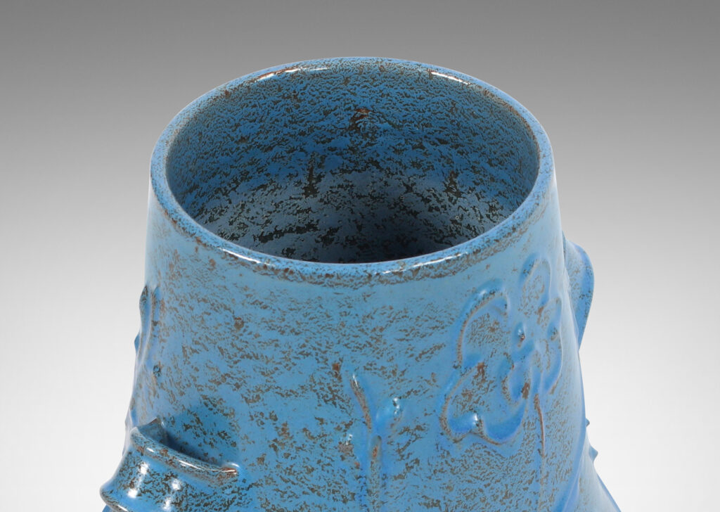 Gallery BAC gourd form with wide mouth, handles, and stylized floral reliefs, glazed in a cerulean blue