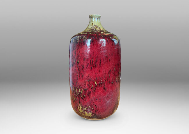 Gallery BAC straight-sided ovoid form and spout mouth in saturated burgundy oxblood glaze with pale gray-tan accents