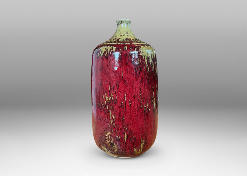 Gallery BAC straight-sided ovoid form and spout mouth in saturated burgundy oxblood glaze with pale gray-tan accents