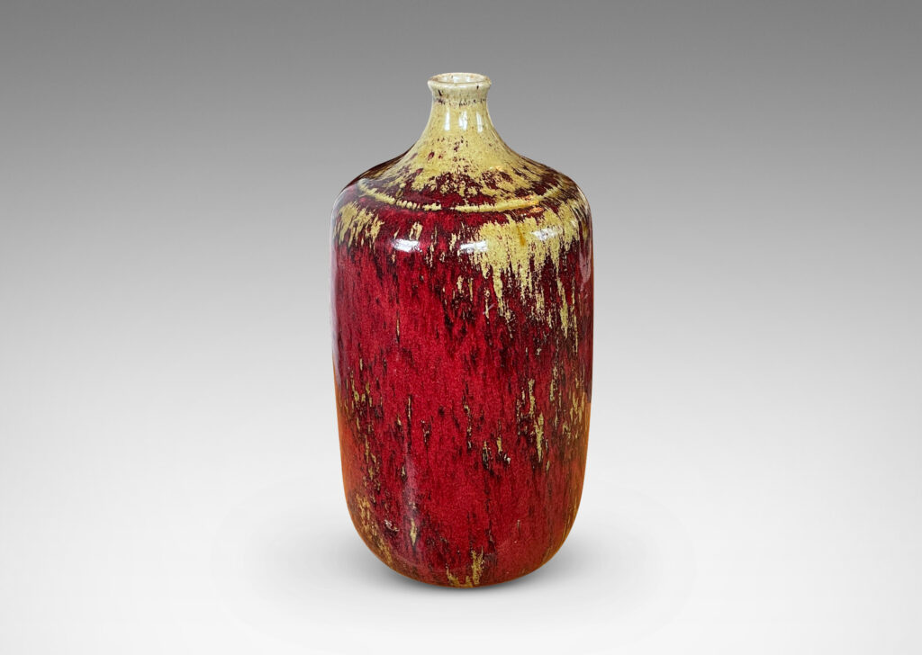 Gallery BAC straight-sided ovoid form and spout mouth in saturated burgundy oxblood glaze with pale gray-tan accents