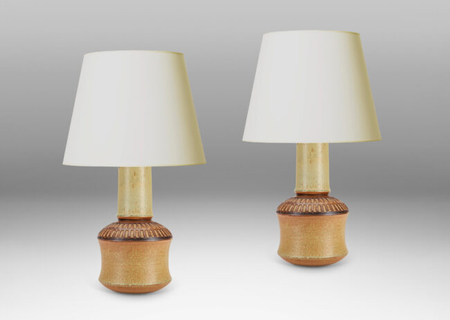 Gallery BAC drum forms with tall necks and intaglio grid on shoulders, glazed in tan and brown