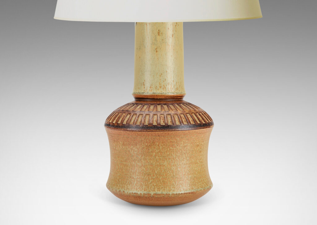 Gallery BAC drum forms with tall necks and intaglio grid on shoulders, glazed in tan and brown