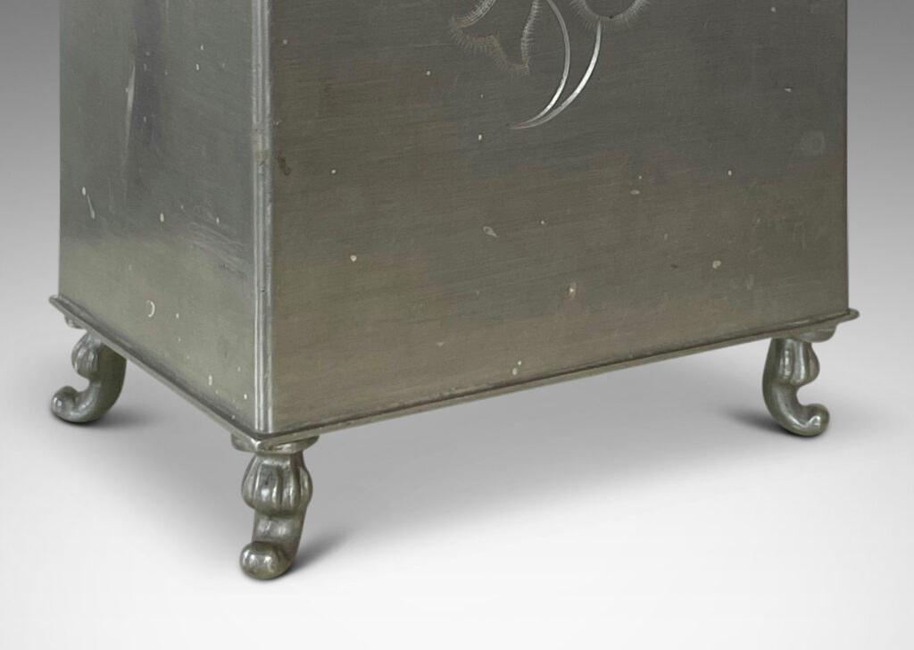 Gallery BAC rectangular form on scroll feet, with engraved floral motif and detailing, and serpent finial on lid