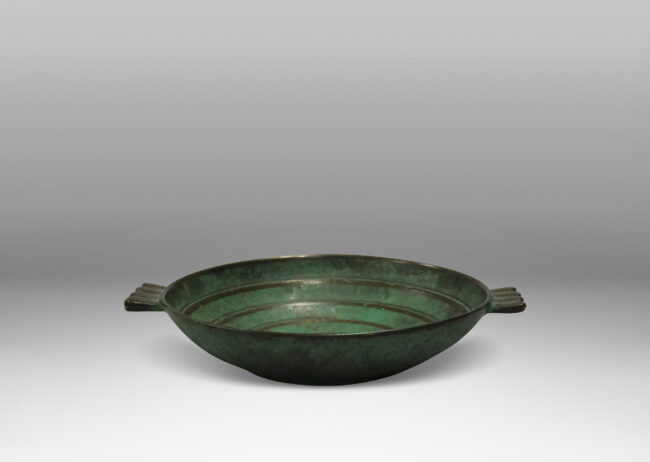 Gallery BAC shallow bowl with handles in verdigris patinated bronze with raised and burnished concentric circles and handle details