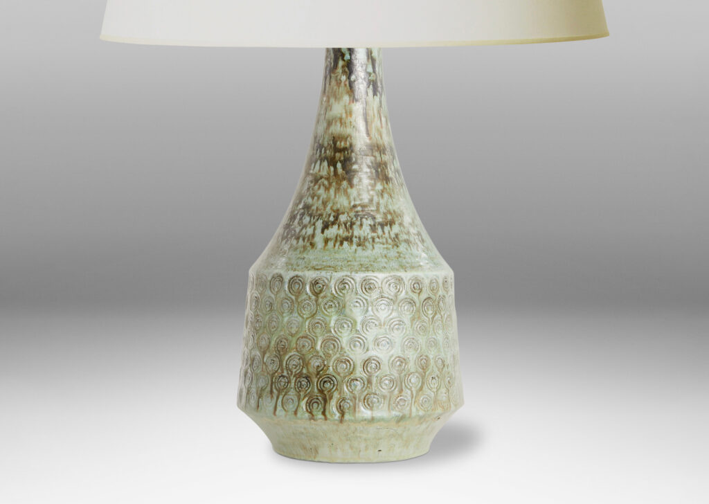 Gallery BAC flared drum form with impressed spiral motifs and a tall sweeping neck