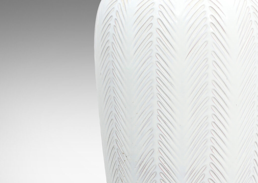 Gallery BAC tall vase forms with carved vertical stripes with fern-like design, glazed in a gloss white