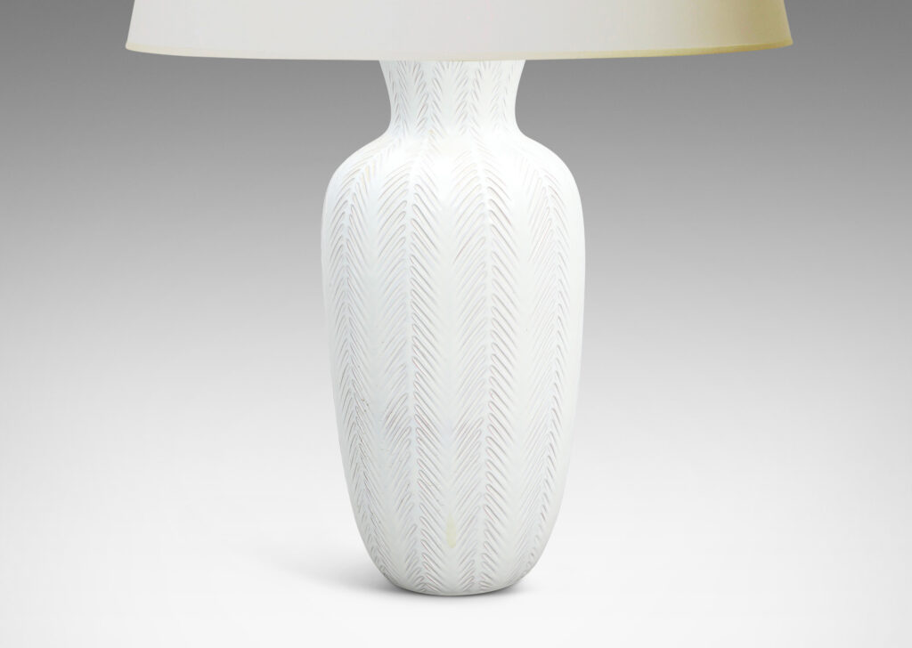 Gallery BAC tall vase forms with carved vertical stripes with fern-like design, glazed in a gloss white