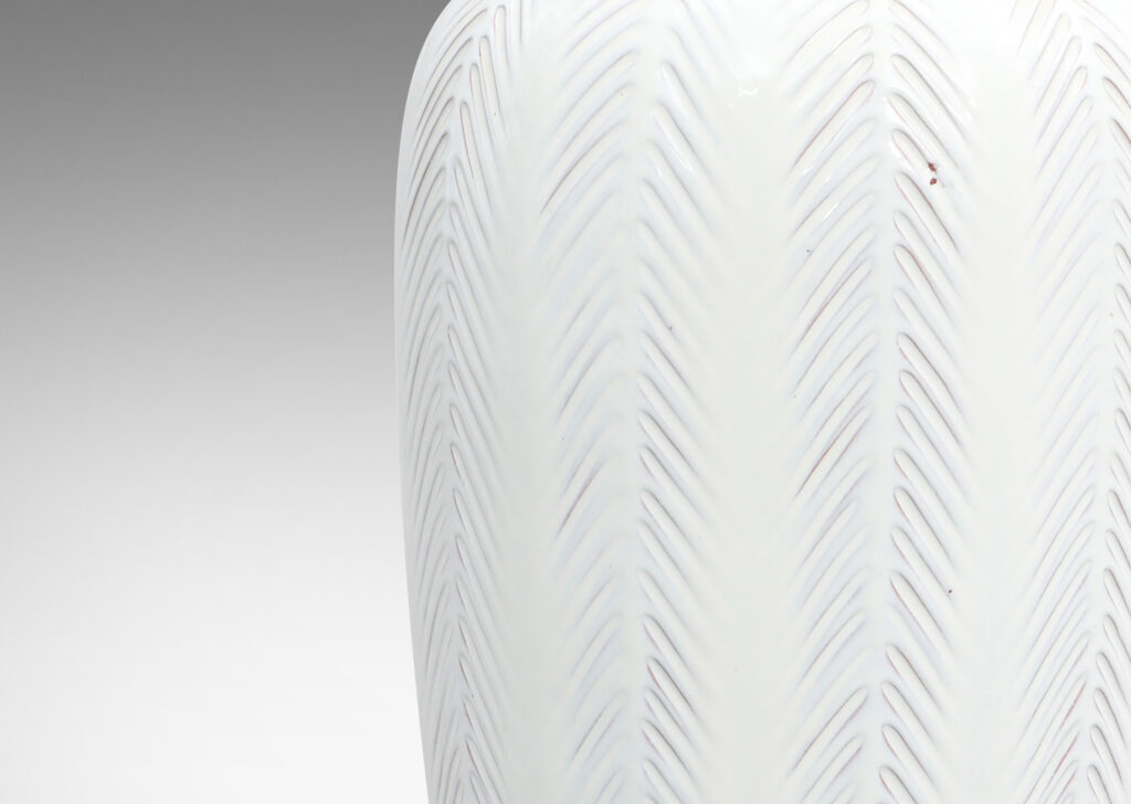 Gallery BAC classically modeled tapering forms with carved fern/palm like vertical stripes in a semi-shine white