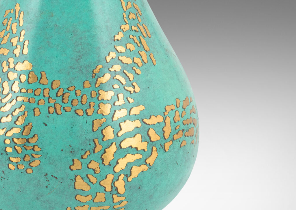 Gallery BAC swelling form in a wonderful pale cerulean verdigris patination with a polished sgraffito free-form garland design