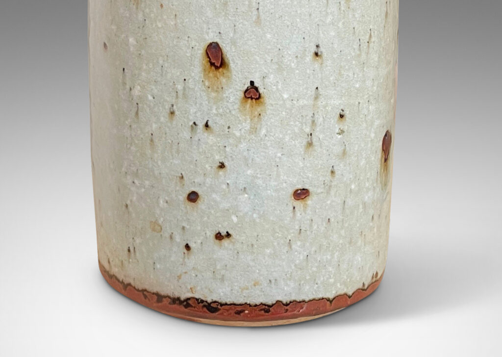 Gallery BAC cylindrical form in pale gray with burnt sienna spots and edges