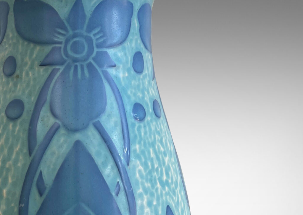 Gallery BAC tall swelling form with carved stylized floral designs in sky and French blue tones