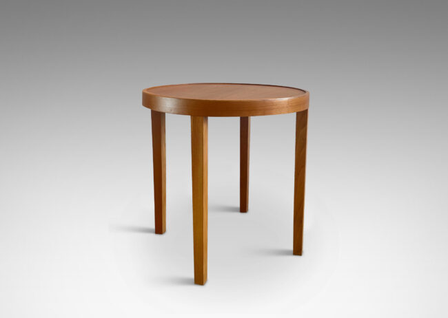 Gallery BAC ound top with four elegantly tapered legs crafted in elm