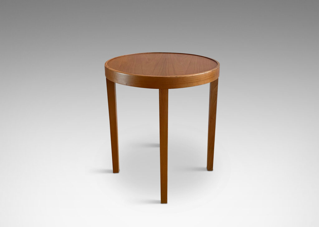 Gallery BAC ound top with four elegantly tapered legs crafted in elm