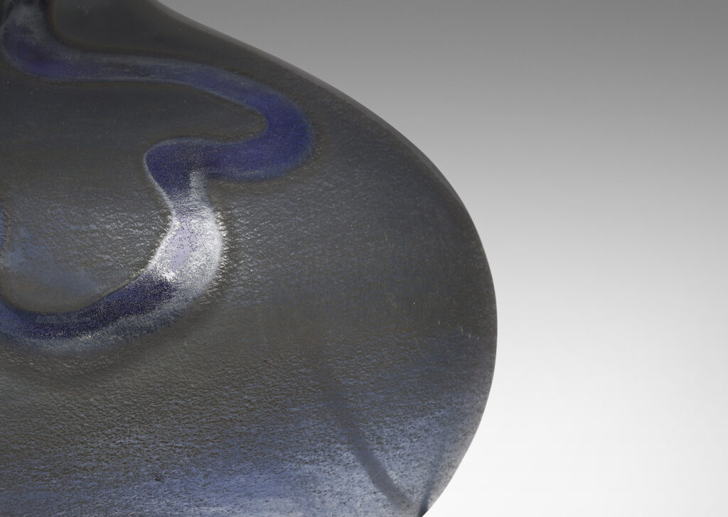 Gallery BAC horizontal ovoid forms with sprouting neck and wave motif in blue tones; hand-blown glass