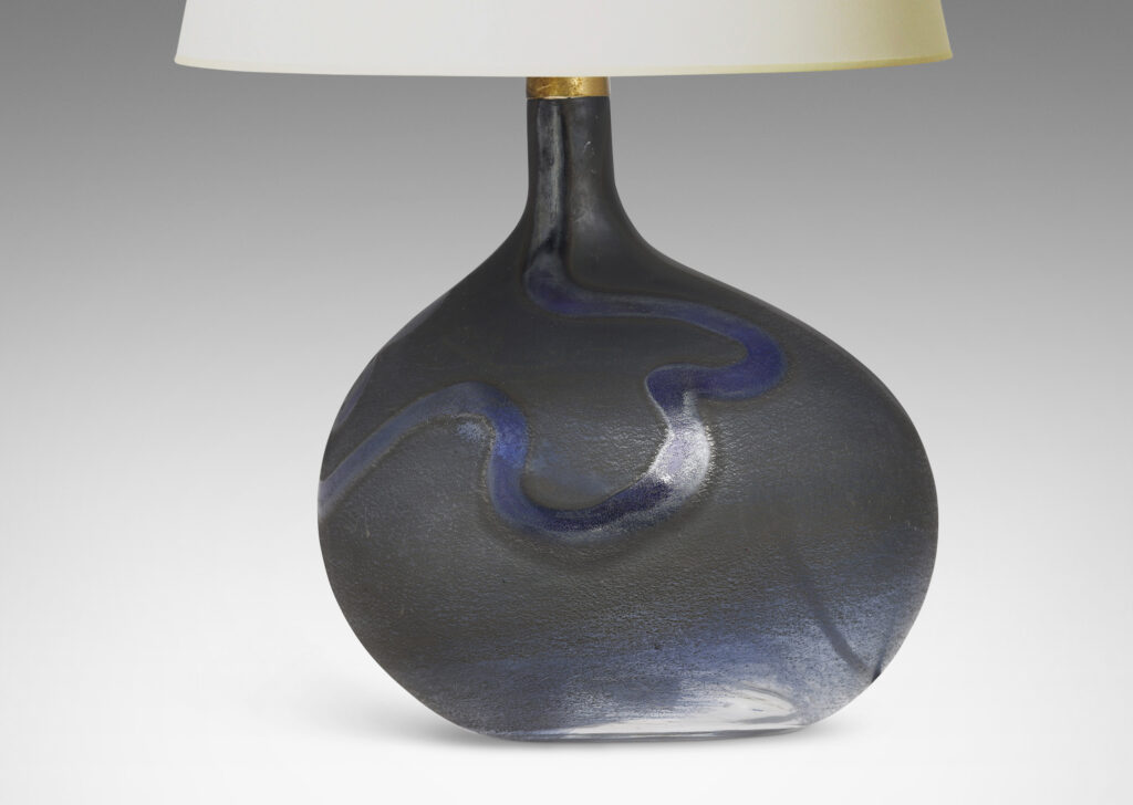 Gallery BAC horizontal ovoid forms with sprouting neck and wave motif in blue tones; hand-blown glass