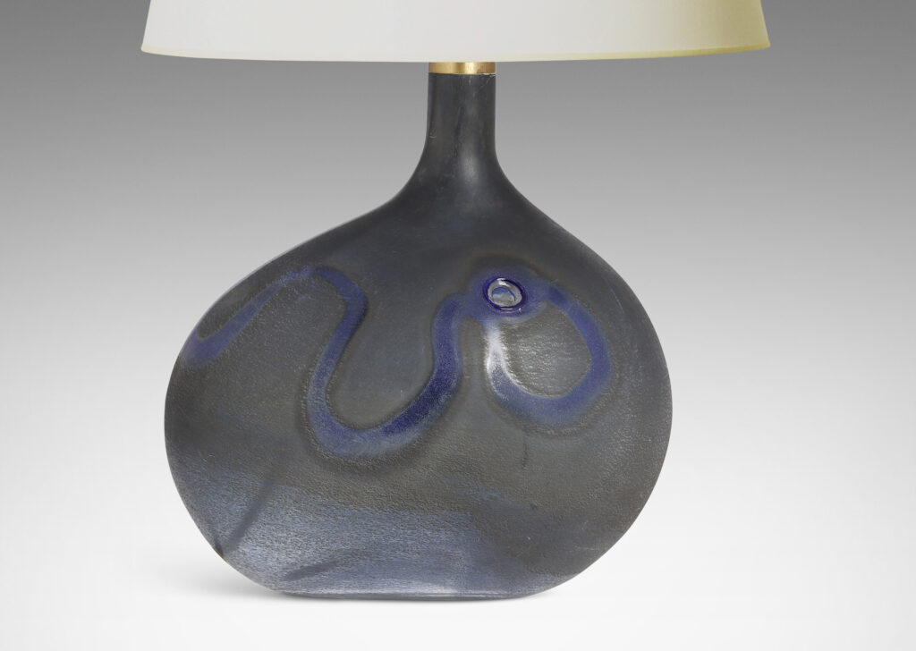 Gallery BAC horizontal ovoid forms with sprouting neck and wave motif in blue tones; hand-blown glass