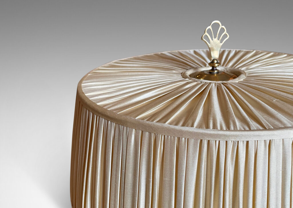 Gallery BAC slender brass stand with bamboo-like decorative rings, two horizontal sockets, and a finial that serves as the switch