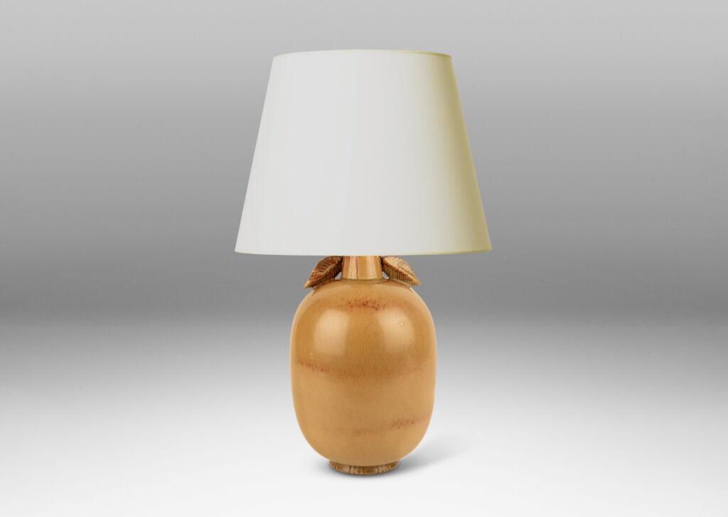 Gallery BAC ovoid form with stem-like neck with leaves, glazed in tan tones with terra cotta accents