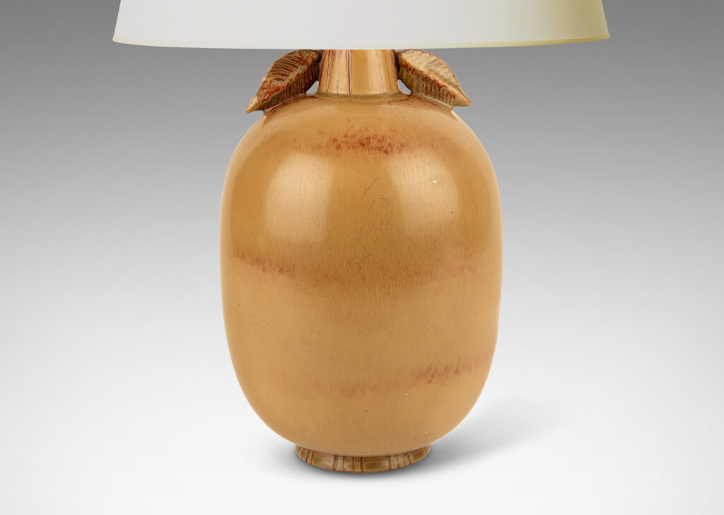 Gallery BAC ovoid form with stem-like neck with leaves, glazed in tan tones with terra cotta accents