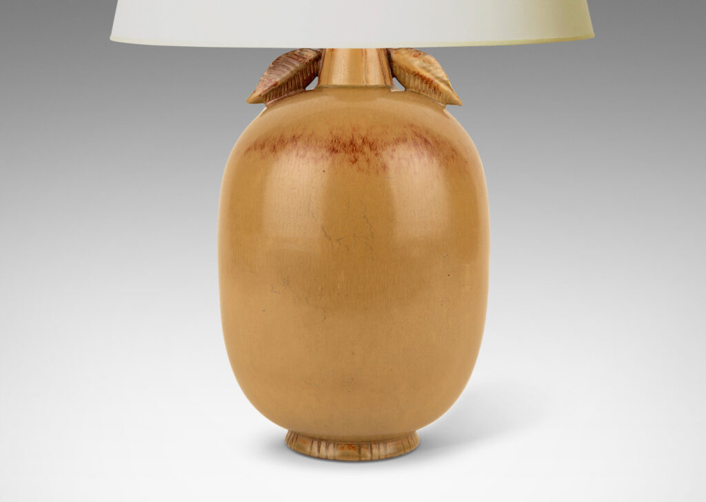 Gallery BAC ovoid form with stem-like neck with leaves, glazed in tan tones with terra cotta accents