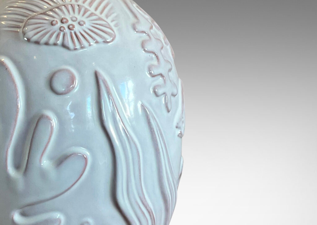 Gallery BAC ovoid form with reliefs depicting marine flora and fauna in a warm eggshell ivory glaze