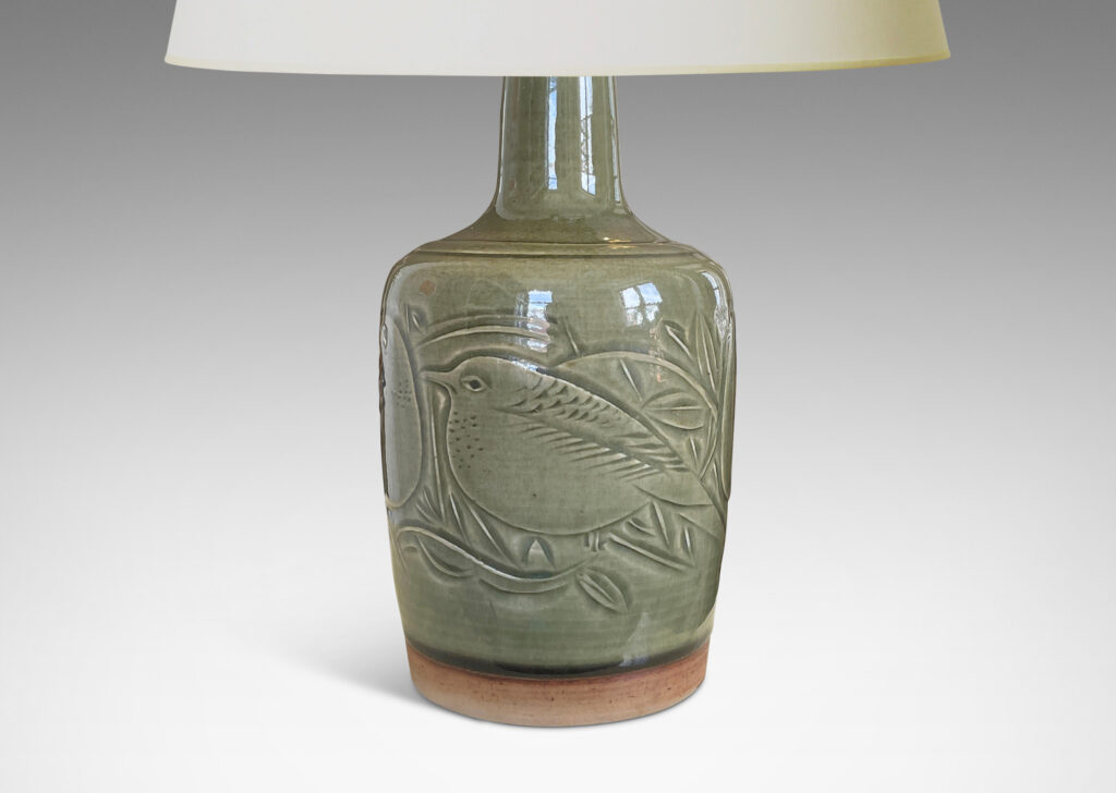 Gallery BAC gently tapered drum form with sprouting neck and beautifully carved reliefs depicting birds, glazed in a deep olive