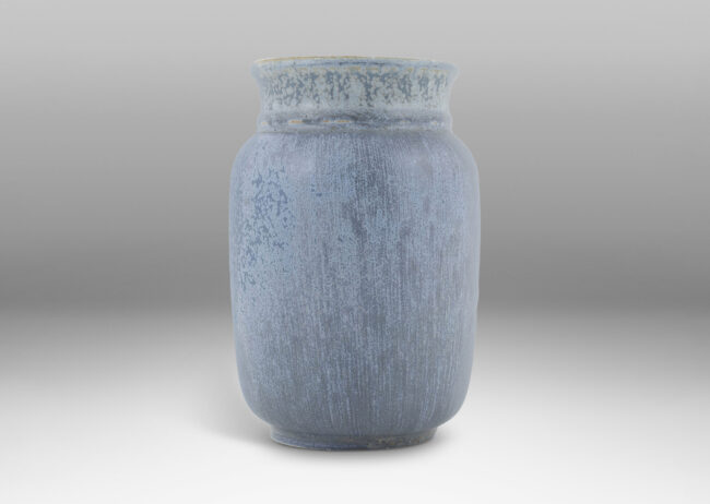 Gallery BAC straight-sided ovoid form with flared mouth, glazed in a soft harefur and dappled light blue glaze