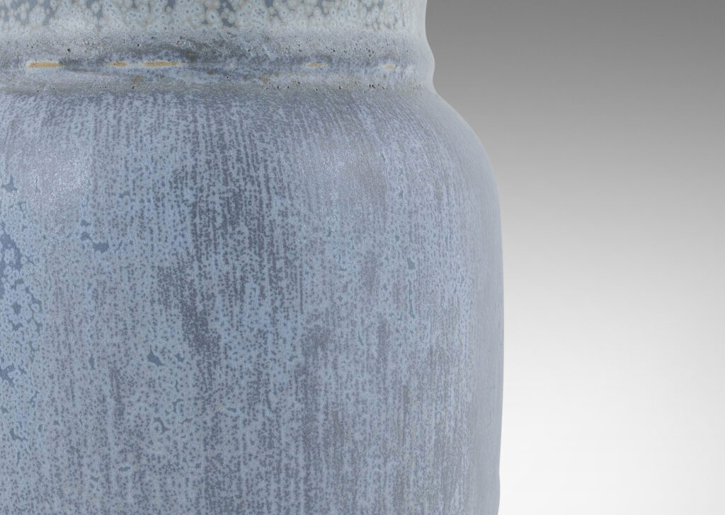 Gallery BAC straight-sided ovoid form with flared mouth, glazed in a soft harefur and dappled light blue glaze