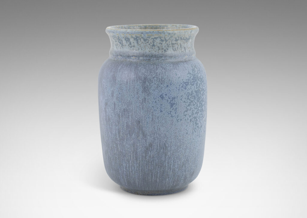 Gallery BAC straight-sided ovoid form with flared mouth, glazed in a soft harefur and dappled light blue glaze