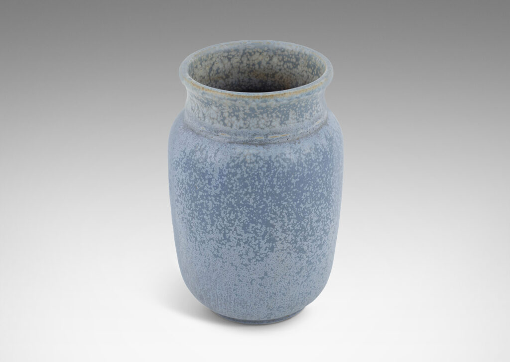 Gallery BAC straight-sided ovoid form with flared mouth, glazed in a soft harefur and dappled light blue glaze