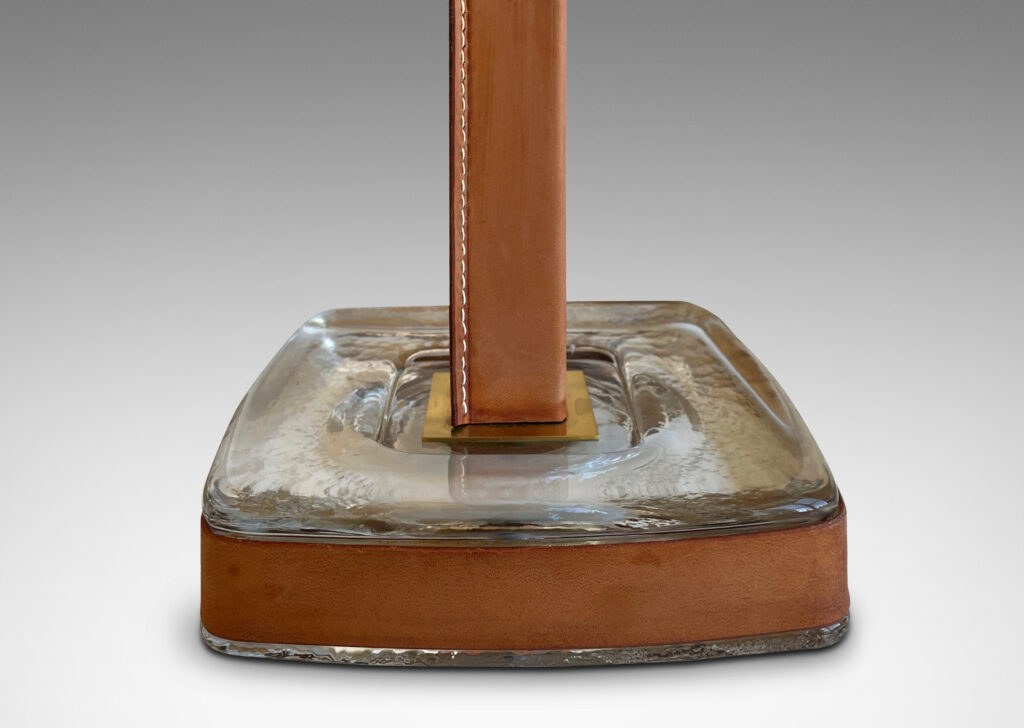 Gallery BAC stand in brass, partially covered in stitched unfinished tan leather, with a hand-formed crystal base