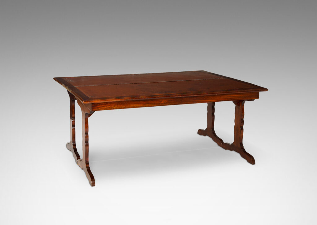 Gallery BAC “tric-trac” folding mechanism that doubles the table’s size, with cut-out style legs in the Regency taste and original leather insets on top