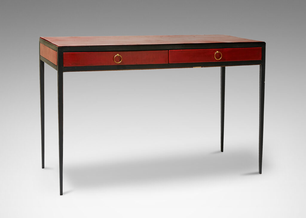 Gallery BAC iron frame ending in attenuated tapering legs, oak casework covered with red-brown leather, and brass ring pulls