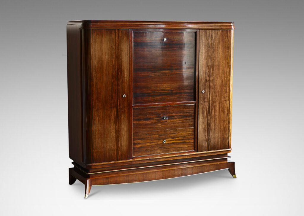 Gallery BAC rosewood and with brass mounts with drop front secretaire finished internally in maple, flanked by two cabinets and with three drawers beneath