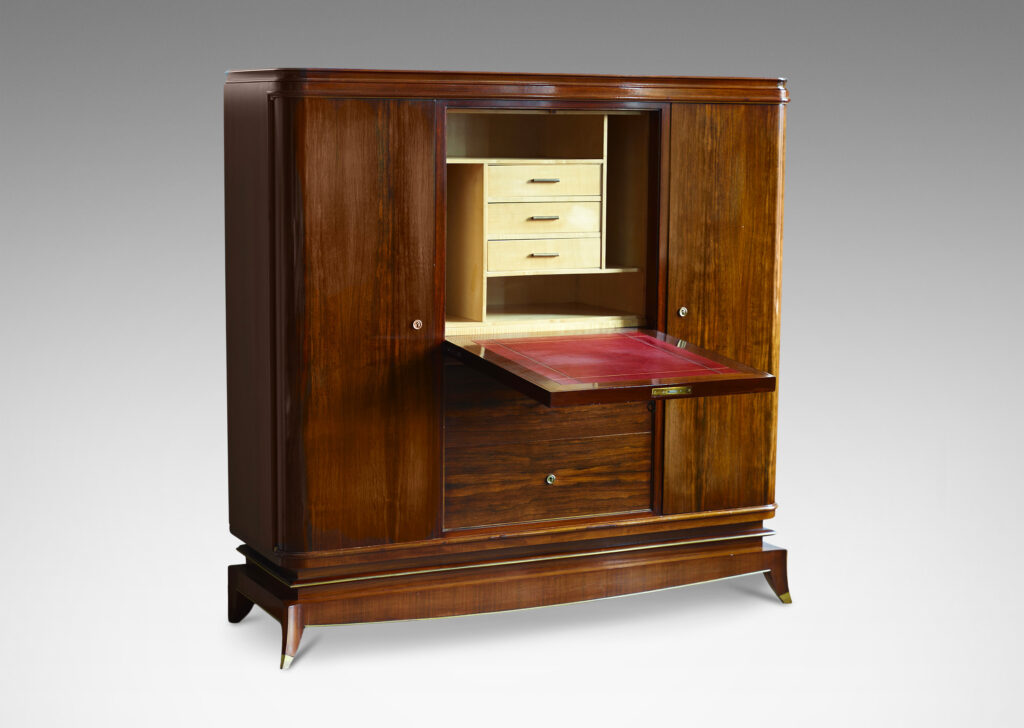 Gallery BAC rosewood and with brass mounts with drop front secretaire finished internally in maple, flanked by two cabinets and with three drawers beneath