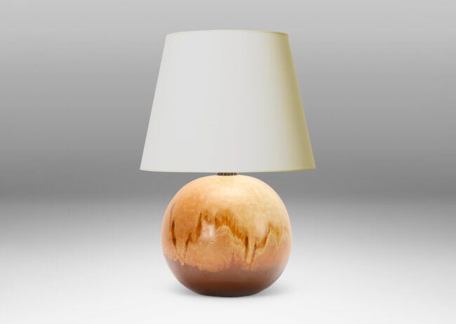 Gallery BAC having a globe form with a flowing brown and sandy tone glazing evocative of birch burl