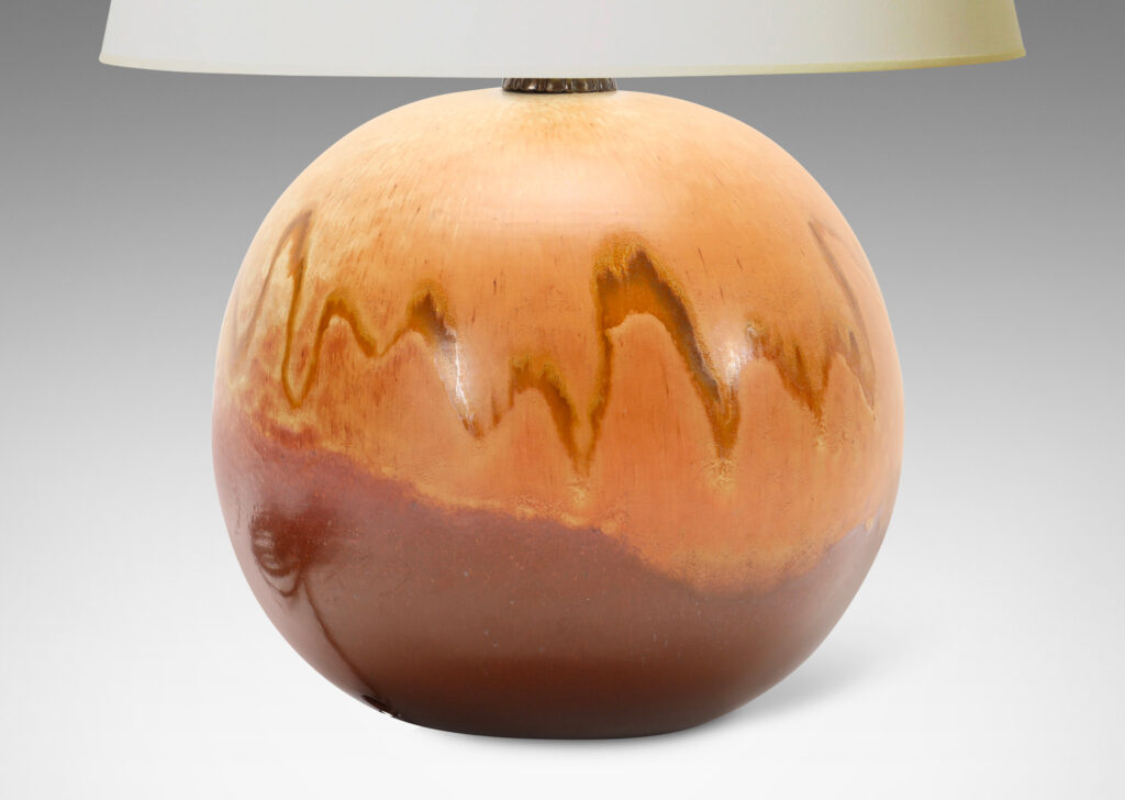 Gallery BAC having a globe form with a flowing brown and sandy tone glazing evocative of birch burl