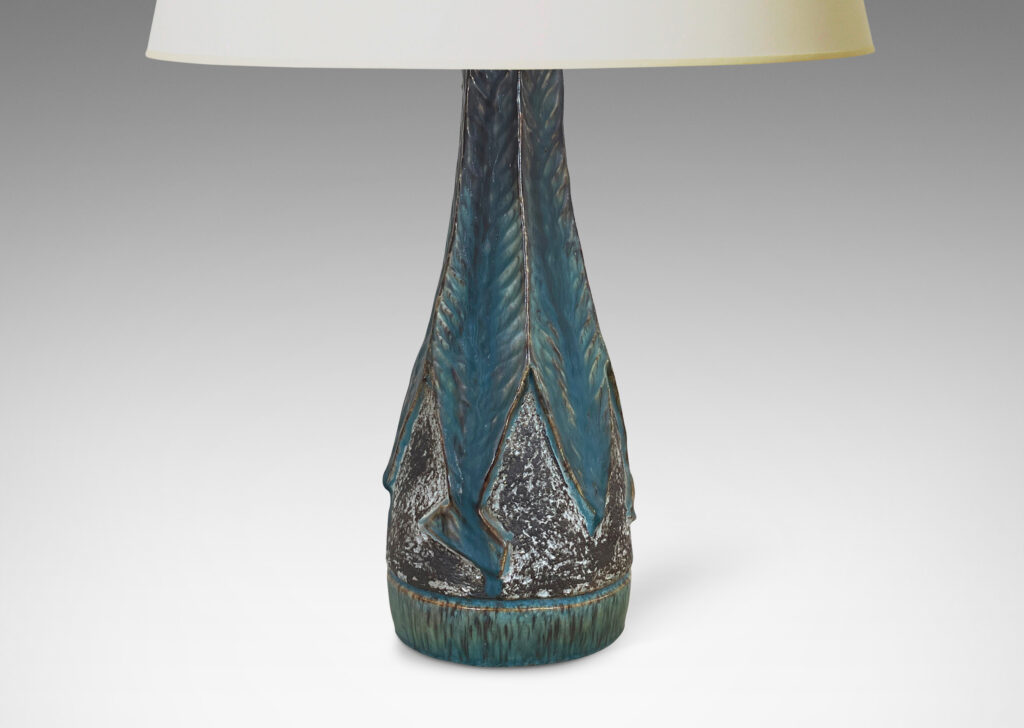 Gallery BAC aceted conical form, with robustly carved leafy forms glazed incornflower blue