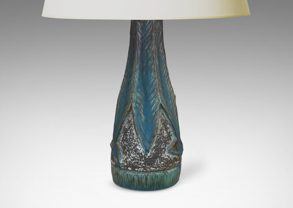 Gallery BAC aceted conical form, with robustly carved leafy forms glazed incornflower blue